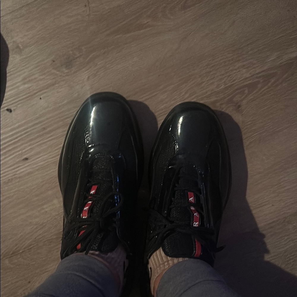 Prada dead stock Shiny Black Sneakers with Red Accents